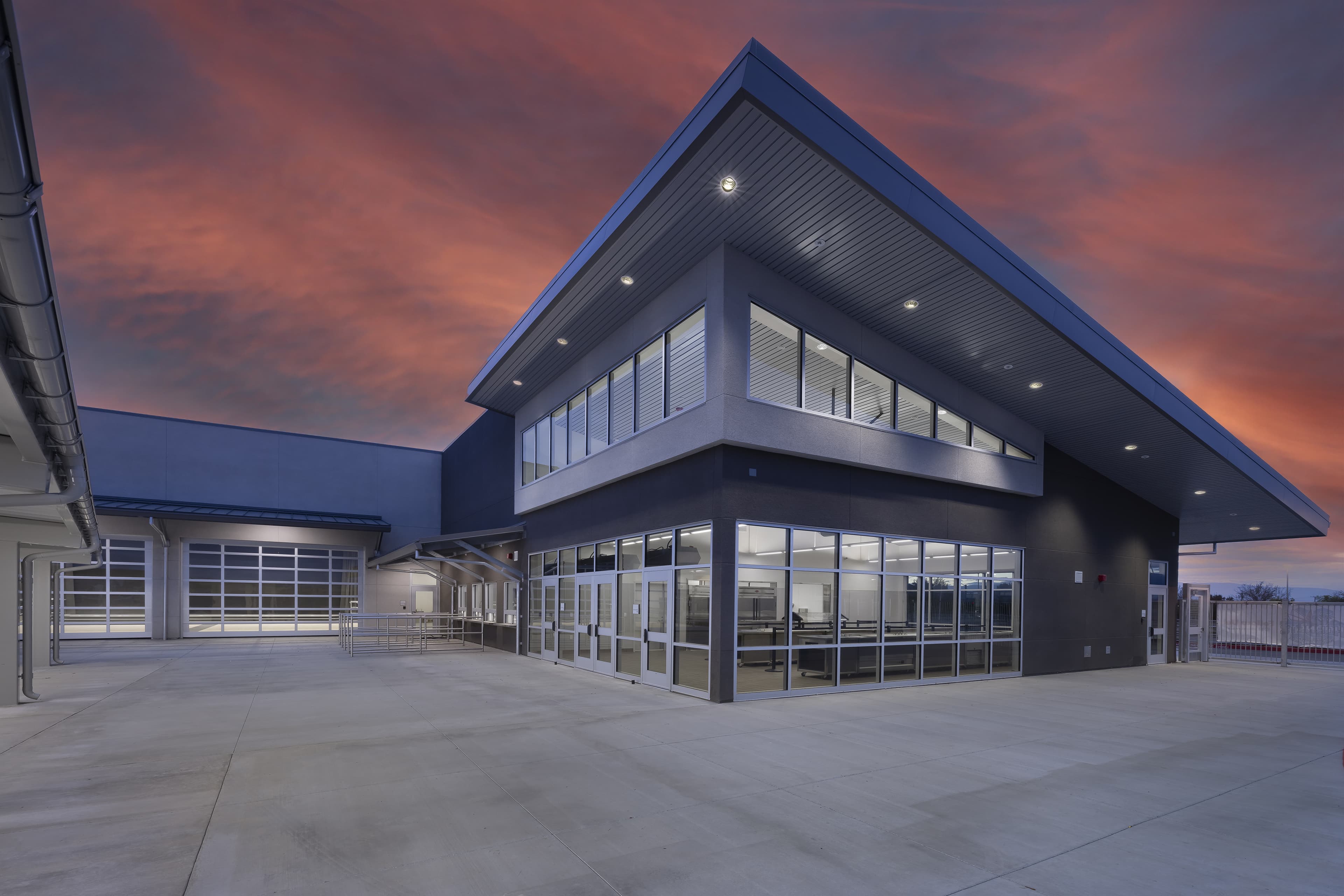 Delta Engineering project: two-story commercial building with a cantilevered roofline at dusk